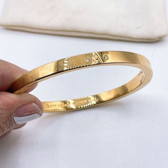 Kate Spade Gold Tone Bangle Bracelet Engraved Logo Clasp Closure - Picture 5 of 6